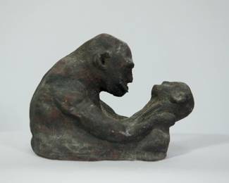 Mid Century studio pottery sculpture of a man holding a child, signed Becker