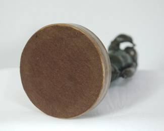 Bottom of bronze sculpture of a standing child