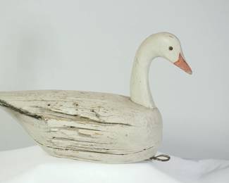 Side view of the first the antique carved goose decoy