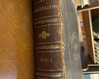 Spine detail of "Longfellow's Poems: Volume I" by Henry Wadsworth Longfellow. Published by The Riverside Press, Cambridge, Mass. in 1880. Printed by H.O. Hougton & Co.