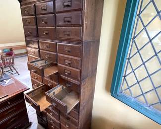 3/4 view with open drawers of the easy to move five section stacking  barrister style oak letter file with 9 drawers per section.  34 1/4" wide x 13" deep x 74 1/2" high