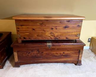 Top trunk: Acme Red Cedar Chest, manufactured by Acme Manufacturing company, South Bend, IND. Measures 42 1/2" wide x 19" deep x 17" high