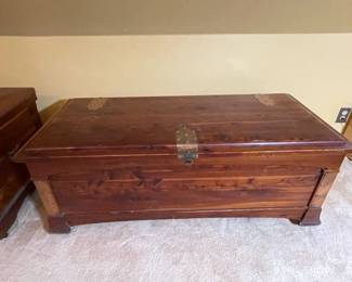 Mid Century Modern cedar chest with decorative brass lock and hinges, measures 49 1/2" wide x 22 1/2" deep x 19 1/2" high