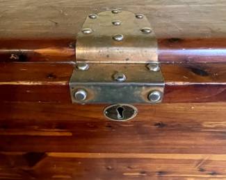 Lock detail of Mid Century Modern cedar chest with decorative brass lock and hinges