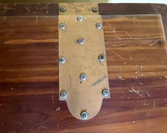 Hinge detail of Mid Century Modern cedar chest with decorative brass lock and hinges