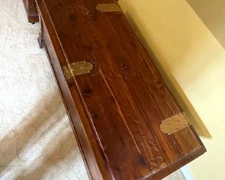 Top view of Mid Century Modern cedar chest with decorative brass lock and hinges