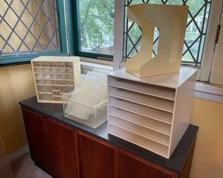 From left to right: plastic jewelry organizer storage, 3 medium sized organizer bins, and 6-shelf paper organizer rack