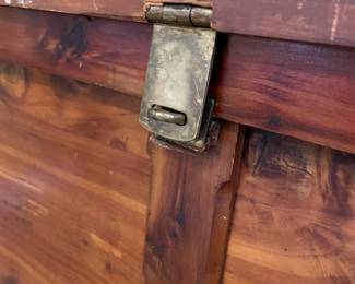 Lock detail of vintage cedar chest with hinged lock and metal side handles