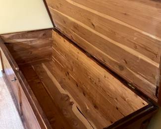 Interior detail of vintage cedar chest with hinged lock and metal side handles