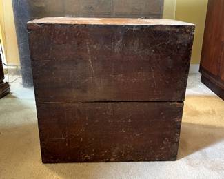 Bottom view of almost-square vintage wood storage chest with corners beautifully seamed with a box joint