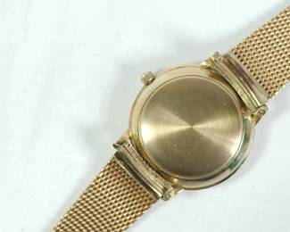 Back of Le Coultre Master Mariner gold wrist watch with gold mesh band still in original green velvet display box. Band reads Kestenmade 10K G.F. USA