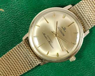 Detail of Le Coultre Master Mariner gold wrist watch with gold mesh band still in original green velvet display box. Band reads Kestenmade 10K G.F. USA