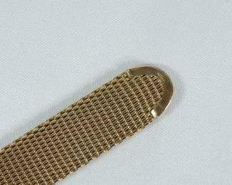 Band detail of Le Coultre Master Mariner gold wrist watch with gold mesh band still in original green velvet display box. Band reads Kestenmade 10K G.F. USA