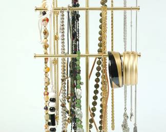 Assorted necklaces and bracelets on a hanging display