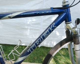 Logo detail of Trek 7300 20" blue men's bicycle, Made in the USA with luggage rack