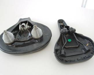 Underside of bicycle seats: wide comfort seat (with springs) and Magna saddle seat