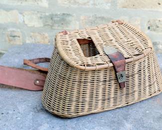 Vintage wicker fishing creel or basket with leather straps and closure