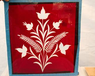 19th century ruby red "pigeon's blood" cut to clear glass pane, with a wildflower floral design and taped edges, measures 12" x 12"