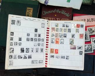 Detail of the inside of "The New Pioneer Album" stamp collection book with stamps