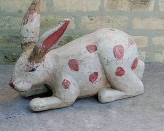 Detail of large carved wooden folk art rabbit figurine