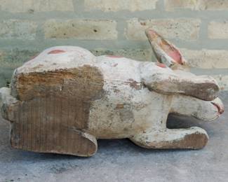 Bottom view of large carved wooden folk art rabbit figurine