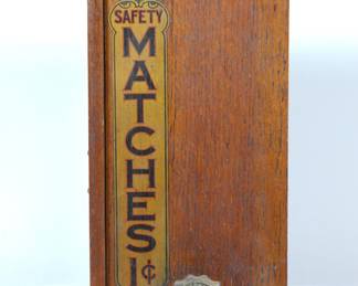 Side view with crank for "I'll Match You for One Cent" antique safety match vending machine