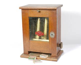 "I'll Match You for One Cent" antique safety match vending machine