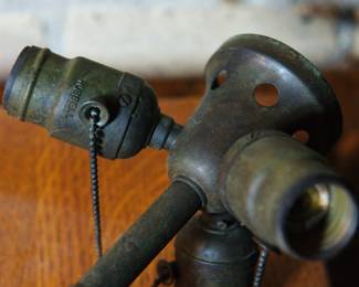 Detail of the socket cluster of bronze lamp
