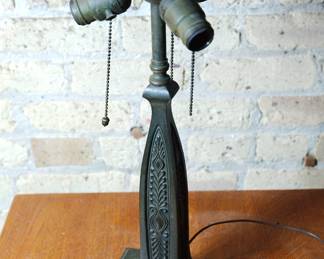 Detail of bronze lamp, without shade showing the socket cluster and the flange the shade rests upon