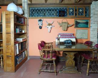 Set of four chairs by The Buckstaff Co. Oshkosh, Wis. The Quality Kind.' This company was in business from 1882 through 2007 and was known for their high-quality resilient products - their furniture was seen as an investment. (The Buckstaff Furniture Company outfitted the US Pentagon's restaurant in a 1958 remodel.) and a beautiful wood dining table