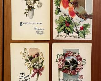 A small sample of the hundreds of postcards: Sweetest Wishes, A Merry Christmas, My Sincerest Wishes, and With You in my Thoughts.