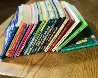 Collection of books of comic strips including Garfield by Jim Davies, The Far Side by Gary Larson