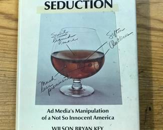 "Subliminal Seduction: Ad Media's Manipulation of a Not So Innocent American" by Wilson Bryan Key, published by Prentice -Hall International Inc. in 1973