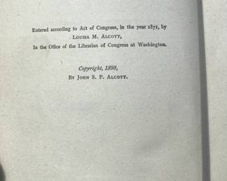 Copyright page of "Little Men" by Louisa May Alcott, published by John Wilson and Son in 1899