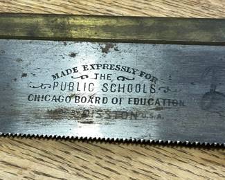 Detail of antique saw, Made expressly for The Chicago Board of Education, Made by Dission, USA
