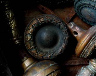 Doorknob detail of antique bronze door hardware from a Cook County building, Seal of Cook County on the plates