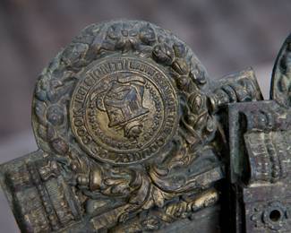 Detail showing Seal of Cook County of Antique bronze door hardware from a Cook County building