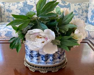 Faux floral arrangement in blue & white planter