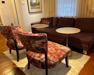 Back of chairs. Fabric is soft to the touch. Professionally upholstered. Upholstery is in great shape and there is lots of extra fabric available. Wood is painted black; has nicks, but easy to refresh wood.