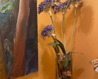 Now $50. Was $100. Artificial flower arrangement in vase with acrylic water. 38"H. 6" across top of the vase but flowers stick out further.