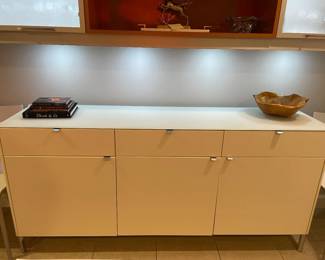 Now $600. Was $1,200. Three drawer, 3 door modern sideboard. 74"Lx17"dx34"h. Feet and tabs have a matt gray finish.