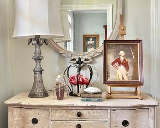 Everything you see in this photo is for sale: antique dresser $325; Anthropologie mirror $175; vintage art, lamp, decorative accessories.