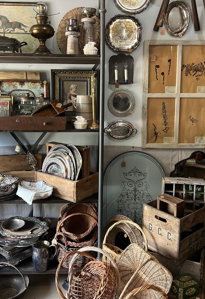 Add patina to your new home with inventory from designer's antique shop: baskets, rustic wood crates, carpenter tool boxes, silver plate, botanical prints