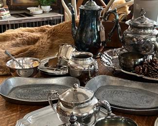 Lots of great silverplate and pewter. Some is polished, but most has great age and patina on it.  Not just for kitching/dining use anymore! Layer these pieces into your home decor. Flowers in a teapot, candles on a tray, a silver cup on top of a stack of books. 
