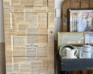 Antique door decoupaged front and back in vintage music sheets. Great decorative piece for anyone who loves music.