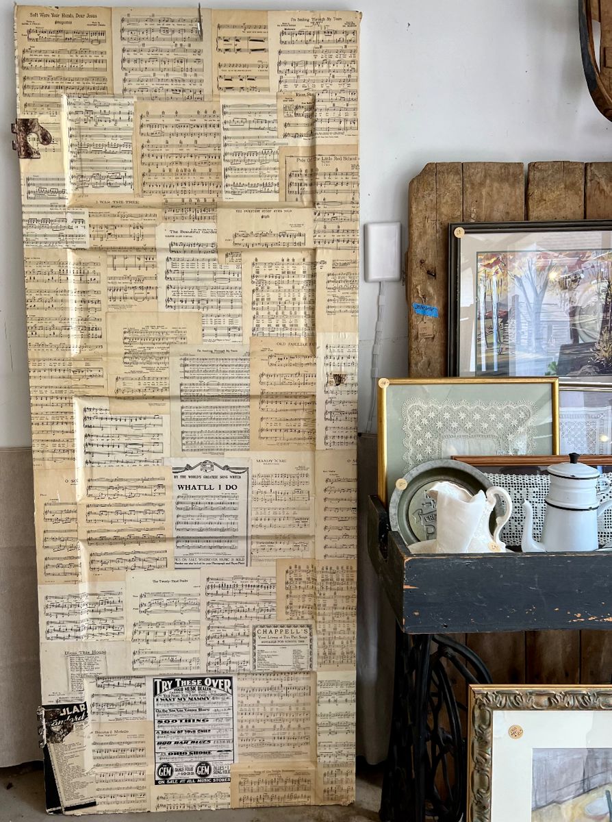 Antique door decoupaged front and back in vintage music sheets. Great decorative piece for anyone who loves music.