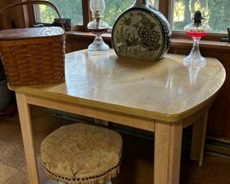 Wooden table, oil lamps, Mexican bird vase, upholstered stool