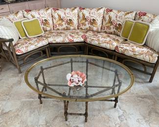 Rattan upholstered sofa/couch w/matching large and small rattan upholstered chairs.  Sold together or separately. Sofa dimensions: Width 32". Large chair: W 28" x D 33".  Small chair: W 30" x D 31".  See matching rattan coffee table with white top to this set in this sale. So pretty for sunroom/porch, too! Rattan glass top oval table Dimensions: 30" x 45"