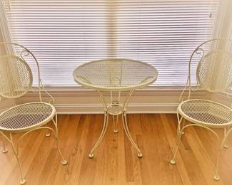 Yellow indoor/outdoor small patio/balcony table and chair set.