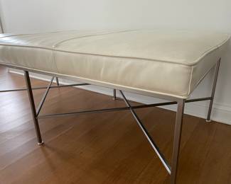 Designer leather bench with brushed metal base. Dimensions: Width 58" x depth 30" x height 21". Retail price was $3,675. 